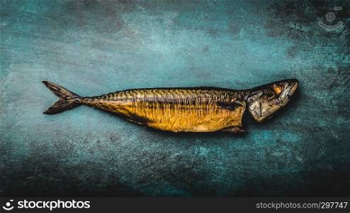 Smoked mackerel on blue background. top view,