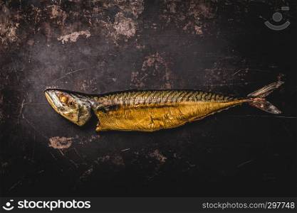 Smoked mackerel on wooden background