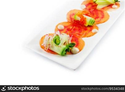 Smoked salmon fillet sliced and decorated with red caviar with zucchini