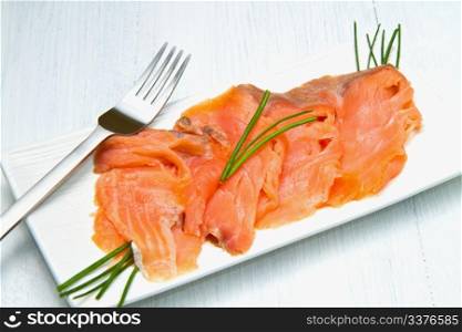 smoked salmon on white dish