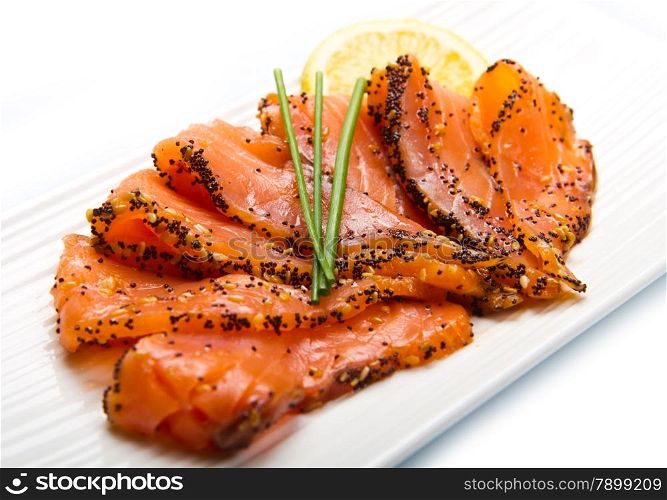 smoked salmon on white dish with chive
