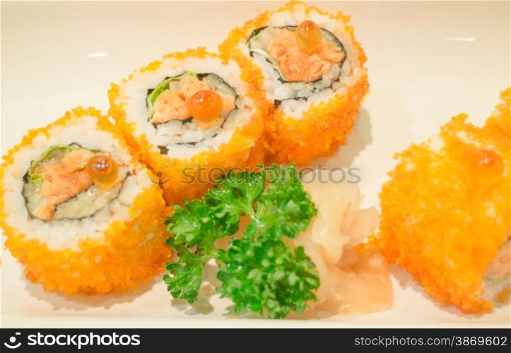 Smoked salmon sushi roll on plate, stock photo