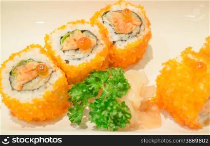 Smoked salmon sushi roll on plate, stock photo