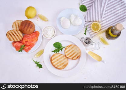 Smoked salmon with poached egg and salad. Breakfast Ingredients - Smoked salmon, poached egg and grulled buns