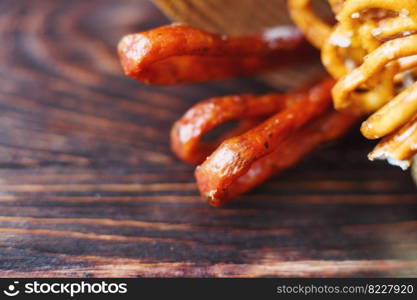 smoked sausage on a wooden dark background .beer snack