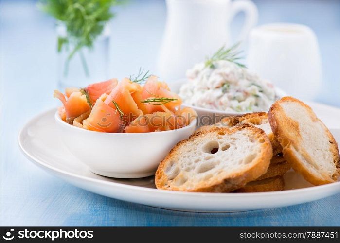 Smoked wild salmon, baguette and soft cheese, selective fcous