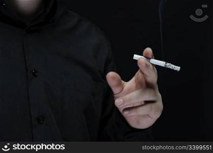 smokes a cigarette on a dark background