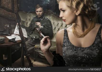 Smoking blonde german soldier with his lovely wife
