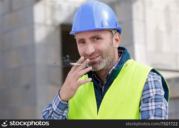 smoking cigarette on construction site