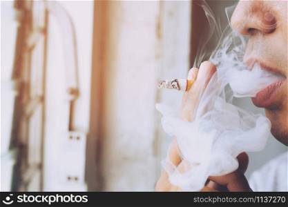 smoking Cigarettes tobacco close up in hand with a soft-focus. concept no quit Cigarettes are dangerous to health.