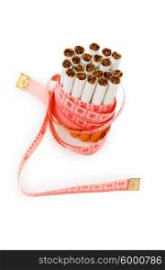 Smoking concept with measuring tape and cigarettes