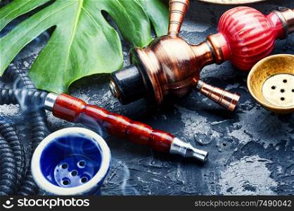 Smoking hookah.Details of Turkish hooka.Shisha with a fruity aroma of tobacco.. Oriental smoking hookah