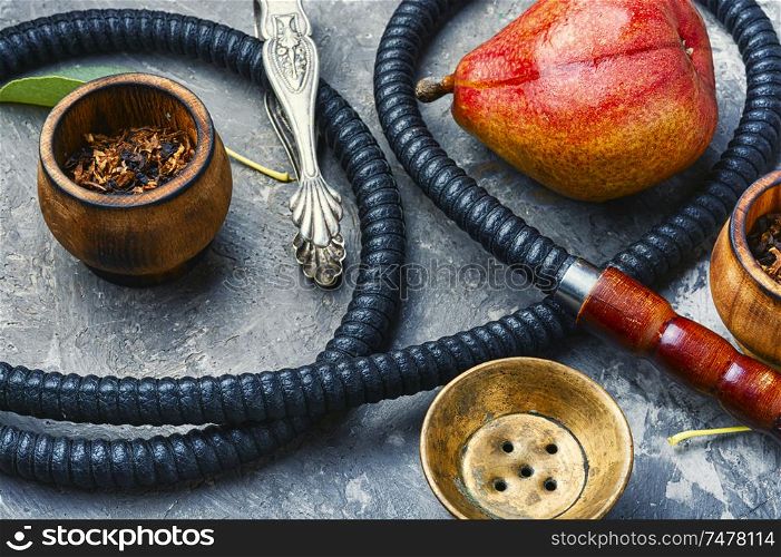 Smoking hookah.Details of Turkish kalian.Shisha with a fruity aroma of tobacco.. Oriental smoking hookah