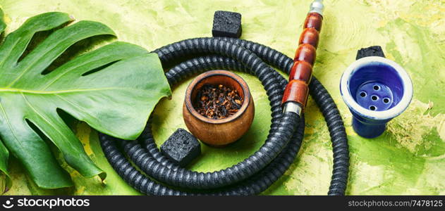 Smoking hookah.Details of Turkish kalian.Shisha with a fruity aroma of tobacco.. Oriental smoking hookah
