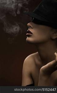 Smoking woman in a hat