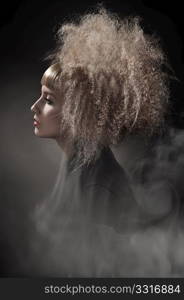 Smoky photo of a woman with gorgeous hair