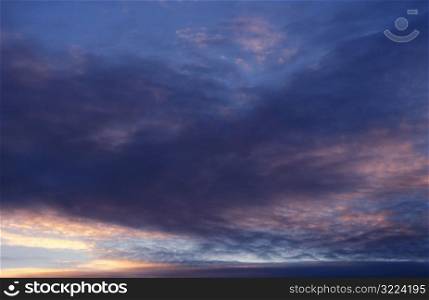 Smoky Purple Clouds In A Sunset Sky