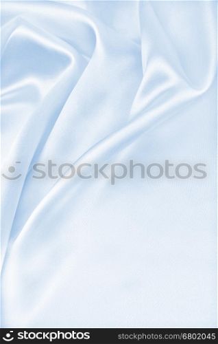 Smooth elegant blue silk or satin luxury cloth texture can use as abstract background. Luxurious Christmas background or New Year background design