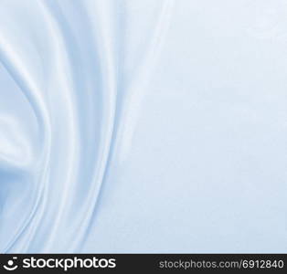 Smooth elegant blue silk or satin luxury cloth texture can use as abstract background. Luxurious background design