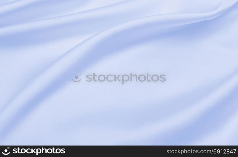 Smooth elegant blue silk or satin luxury cloth texture can use as abstract background. Luxurious background design