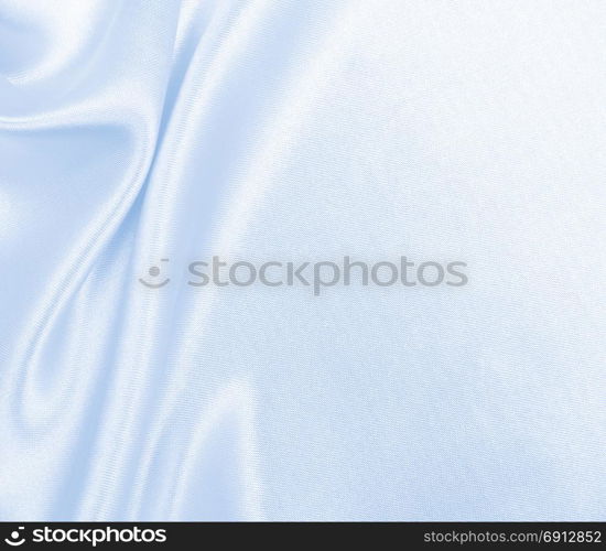 Smooth elegant blue silk or satin luxury cloth texture can use as abstract background. Luxurious background design