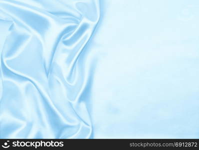 Smooth elegant blue silk or satin luxury cloth texture can use as abstract background. Luxurious background design