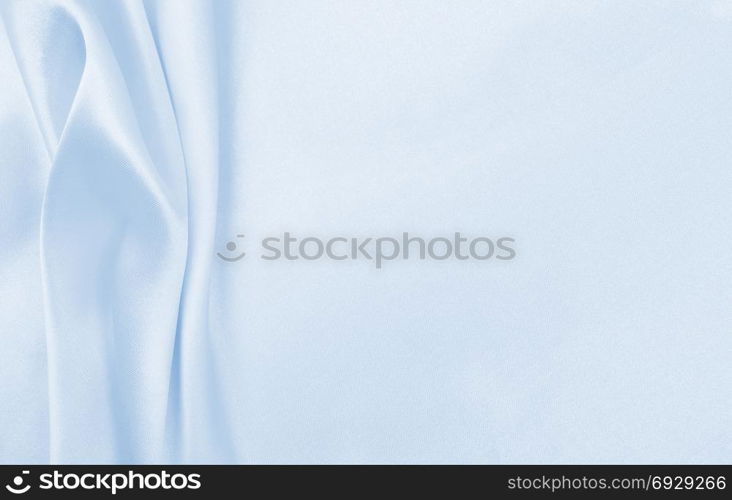 Smooth elegant blue silk or satin luxury cloth texture can use as abstract background. Luxurious background design