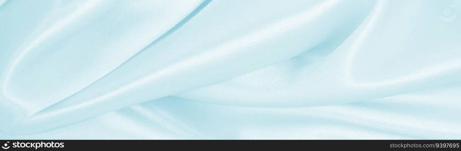 Smooth elegant blue silk or satin luxury cloth texture can use as abstract background. Luxurious background design