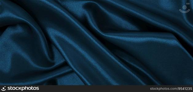 Smooth elegant blue silk or satin luxury cloth texture can use as abstract background. Luxurious Christmas background or New Year background design  