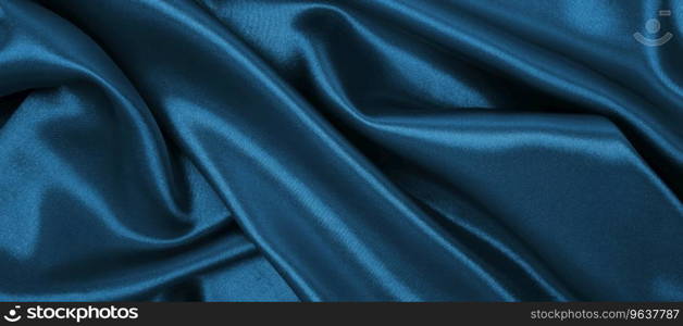 Smooth elegant blue silk or satin luxury cloth texture can use as abstract background. Luxurious Christmas background or New Year background design  