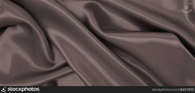 Smooth elegant brown silk or satin luxury cloth texture can use as abstract background. Luxurious background design. In Sepia toned. Retro style