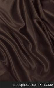 Smooth elegant brown silk or satin texture can use as abstract background. Luxurious background design. In Sepia toned. Retro style