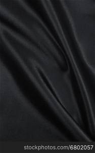 Smooth elegant dark grey silk or satin texture can use as abstract background. Luxurious background design