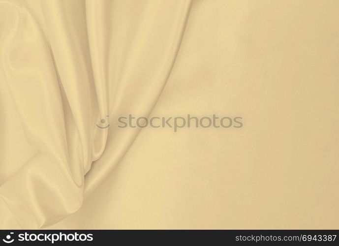 Smooth elegant golden silk or satin luxury cloth texture can use as wedding background. Luxurious background design. In Sepia toned. Retro style