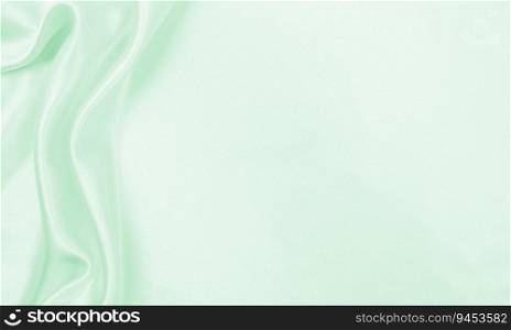 Smooth elegant green silk or satin luxury cloth texture can use as abstract background. Luxurious background design