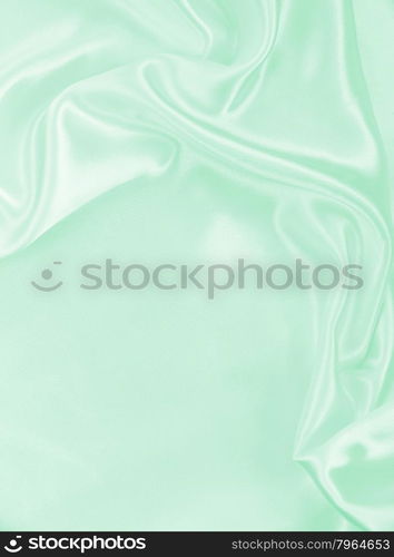 Smooth elegant green silk or satin texture can use as background