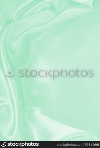 Smooth elegant green silk or satin texture can use as background