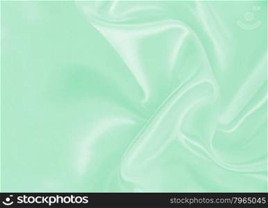 Smooth elegant green silk or satin texture can use as background