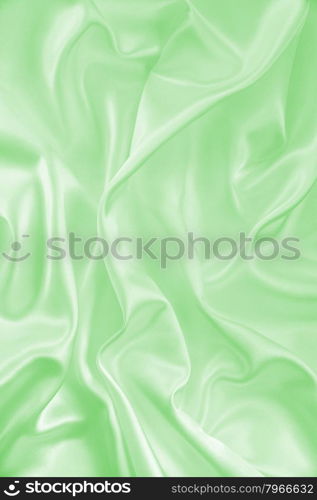 Smooth elegant green silk or satin texture can use as background