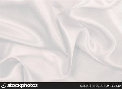 Smooth elegant grey silk or satin luxury cloth can use as wedding background. Luxurious background design