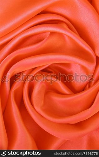 Smooth elegant orange silk or satin can use as background