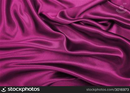 Smooth elegant pink silk or satin luxury cloth texture can use as abstract background. Luxurious background design