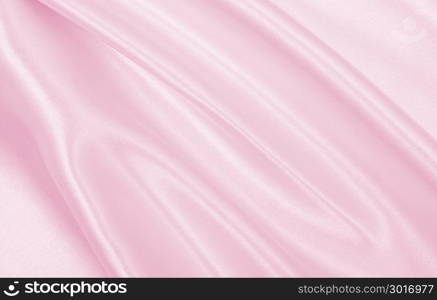 Smooth elegant pink silk or satin texture can use as wedding background. Luxurious valentine day background design