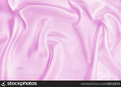 Smooth elegant pink silk or satin texture can use as wedding background. Luxurious valentine day background design