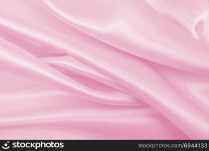 Smooth elegant pink silk or satin texture can use as wedding background. Luxurious valentine day background design