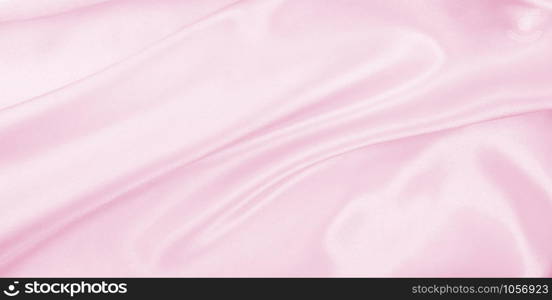 Smooth elegant pink silk or satin texture can use as wedding background. Luxurious background design