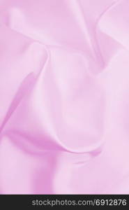 Smooth elegant pink silk or satin texture can use as wedding background. Luxurious background design