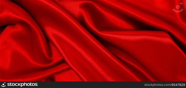 Smooth elegant red silk or satin luxury cloth texture can use as abstract background. Luxurious valentines day background design