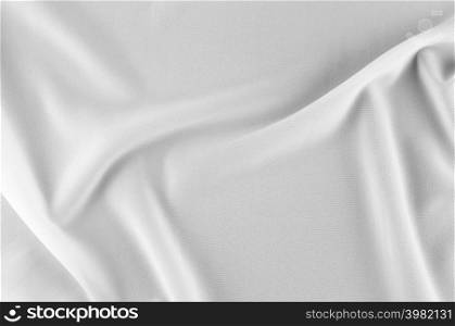 Smooth elegant white silk or satin luxury cloth can use as wedding background. Luxurious Christmas background or New Year background design. white fabric texture. Cloth Textile Surface. top view.. Smooth white silk or satin texture.