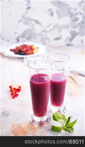 smoothie from berries in glasses and on a table